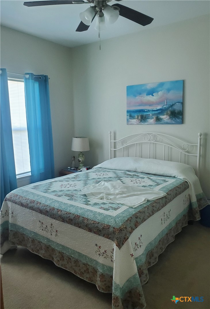 501 13th Street Seadrift, TX 77983 - Photo 19 of 22 a bedroom with a bed and a dresser