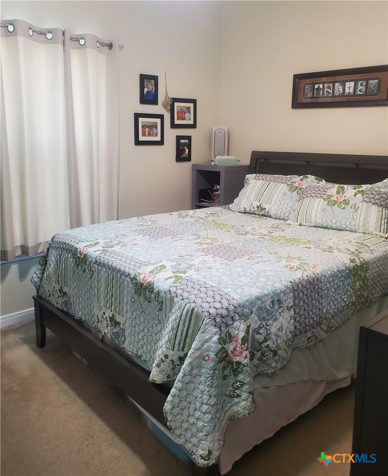 501 13th Street Seadrift, TX 77983 - Photo 21 of 22 a bedroom with a bed and a window