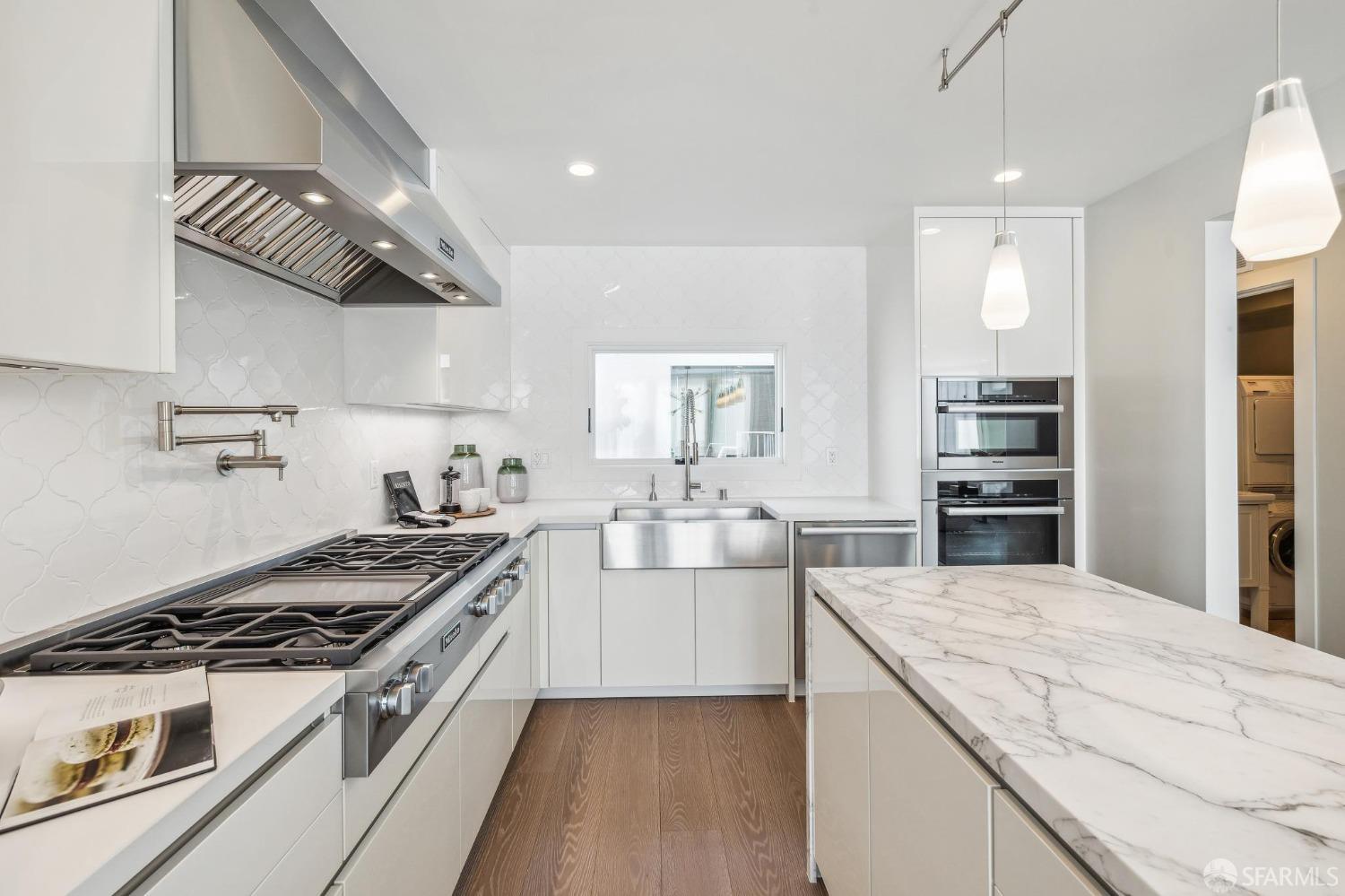 340 25th Avenue San Francisco, CA 94121 - Photo 17 of 73 a kitchen with cabinets and appliances