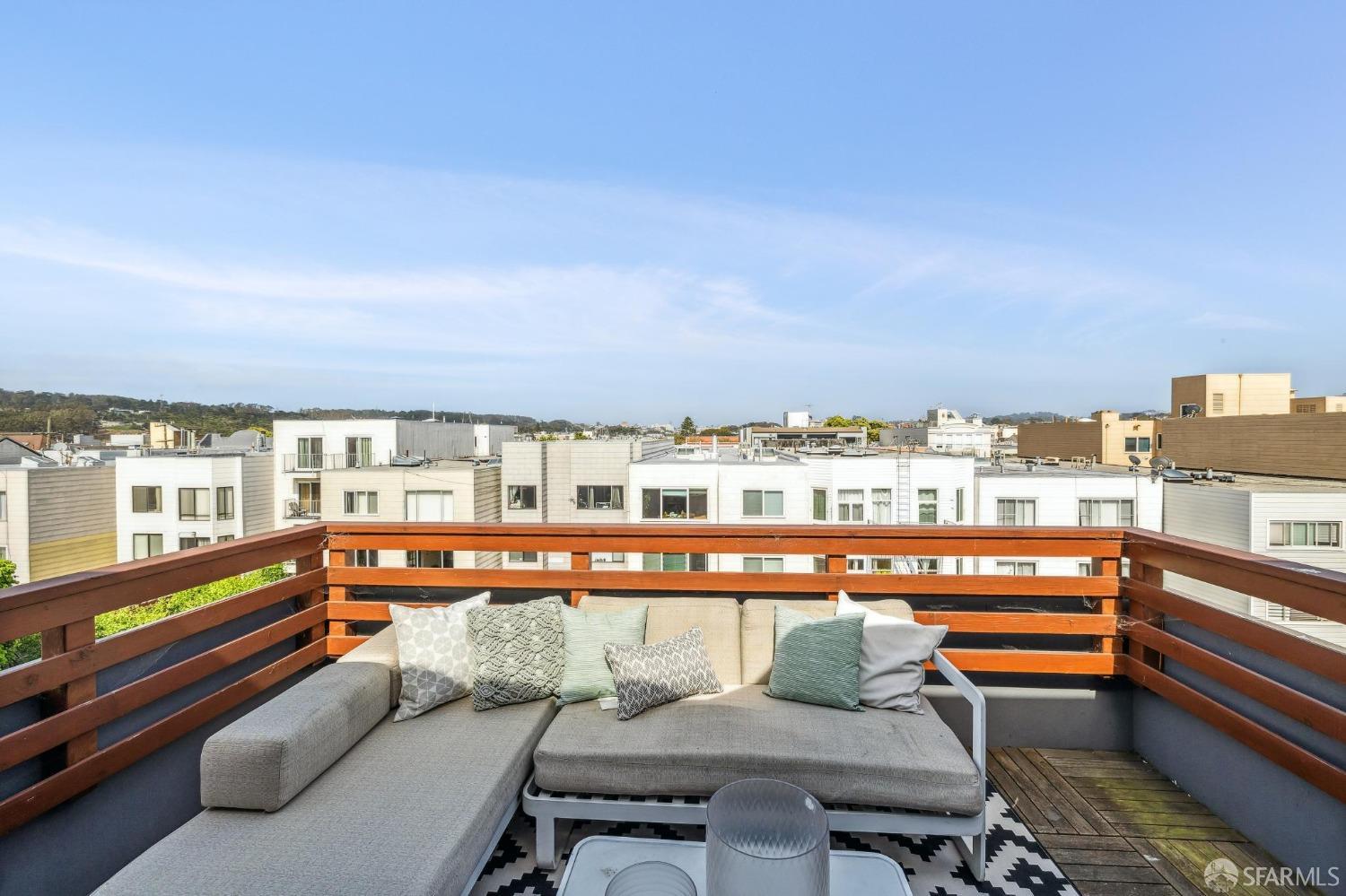 340 25th Avenue San Francisco, CA 94121 - Photo 29 of 73 a view of a chairs and table in a balcony