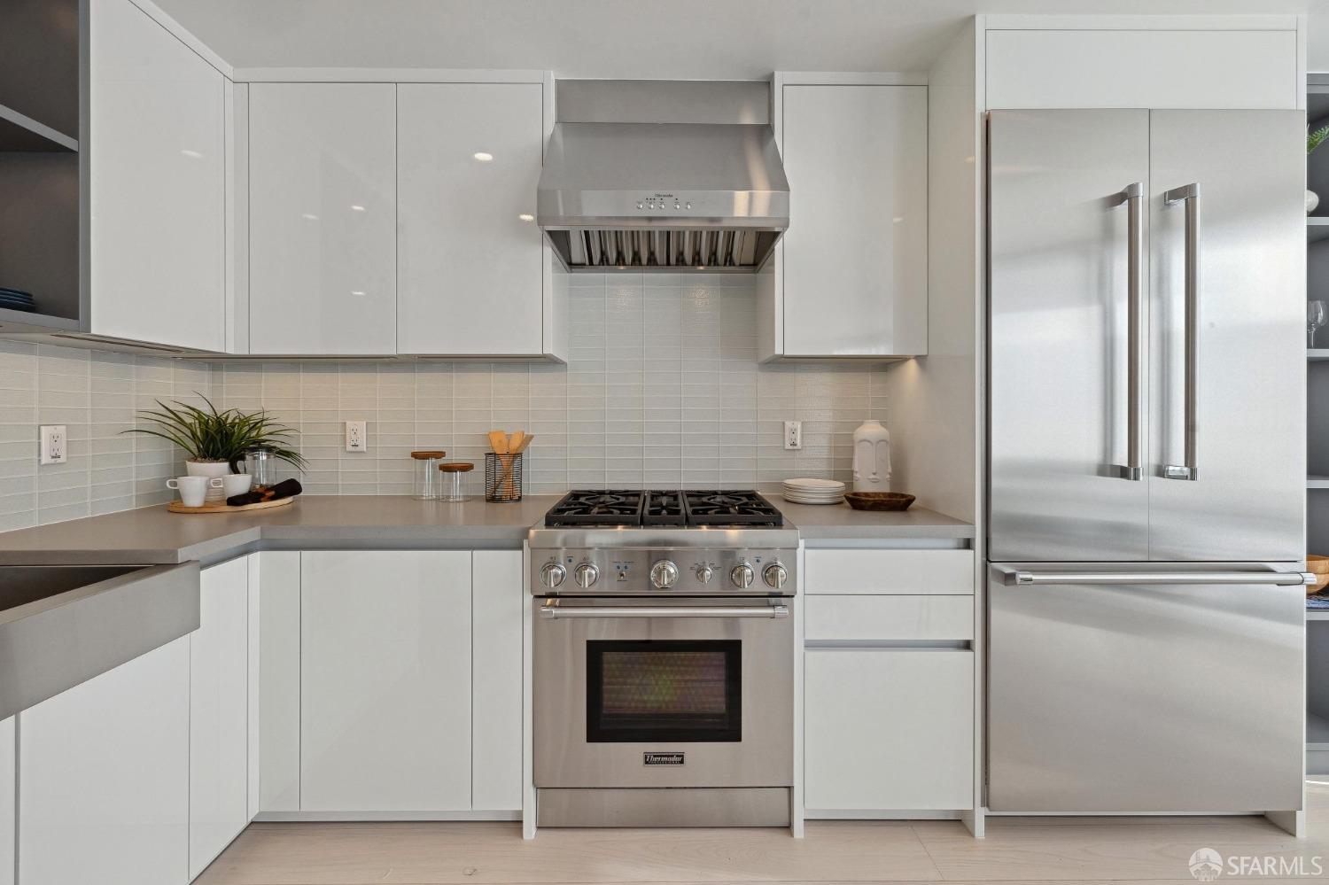 340 25th Avenue San Francisco, CA 94121 - Photo 49 of 73 a kitchen with cabinets and stainless steel appliances