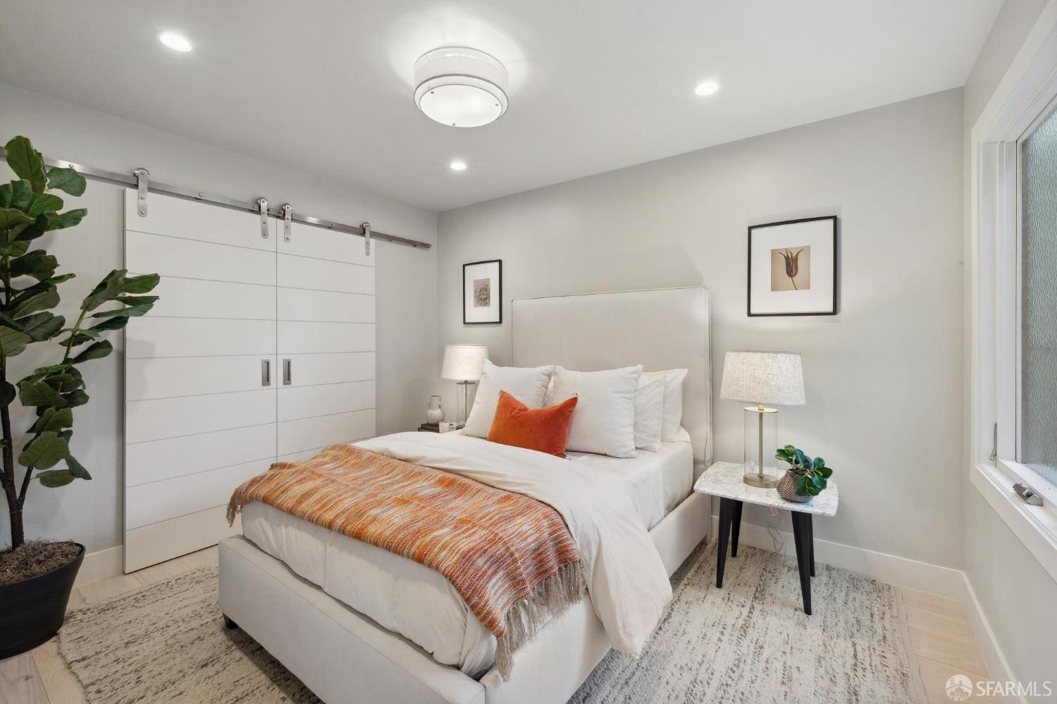 340 25th Avenue San Francisco, CA 94121 - Photo 50 of 73 a bedroom with a bed and a potted plant