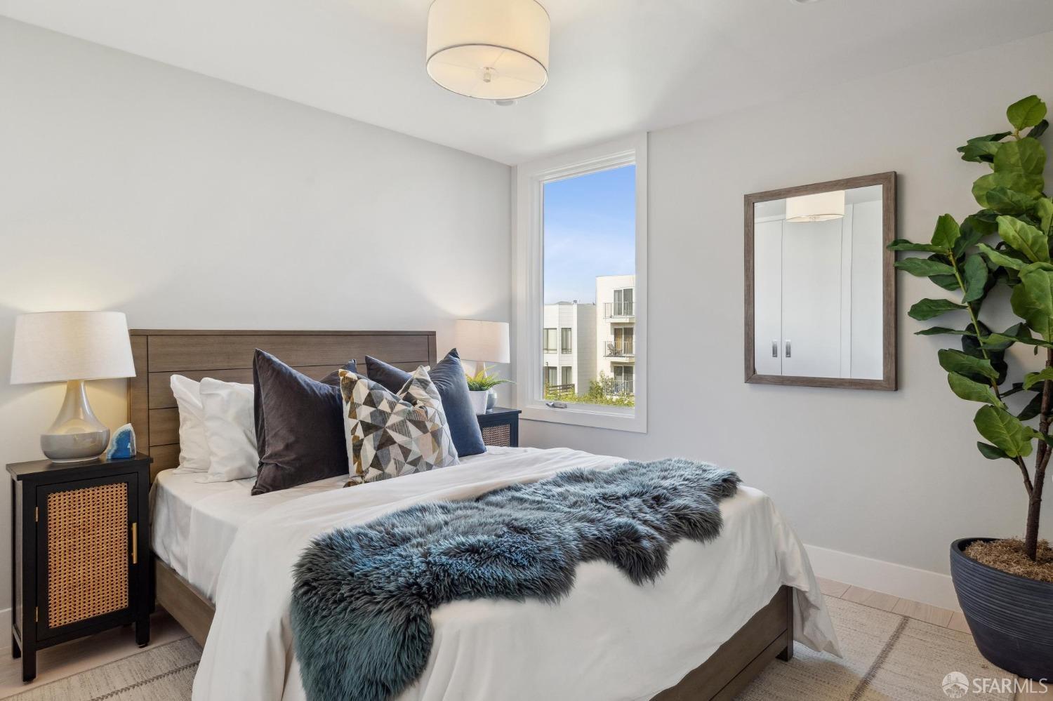 340 25th Avenue San Francisco, CA 94121 - Photo 58 of 73 a bedroom with a bed and a window