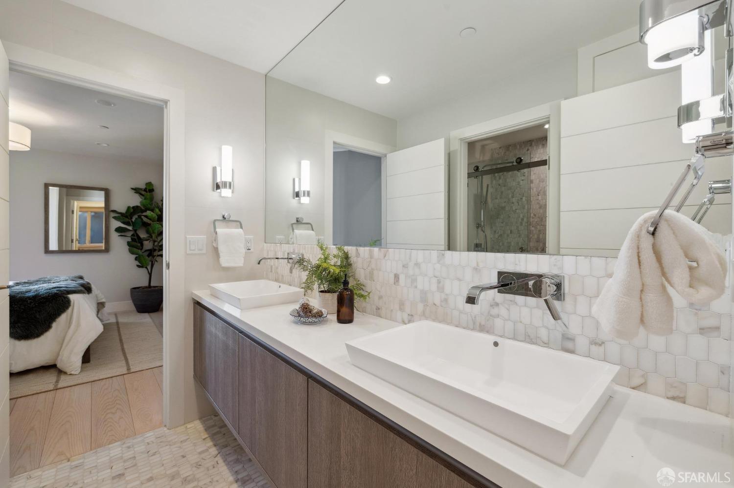 340 25th Avenue San Francisco, CA 94121 - Photo 59 of 73 a bathroom with a double vanity sink a mirror and a shower