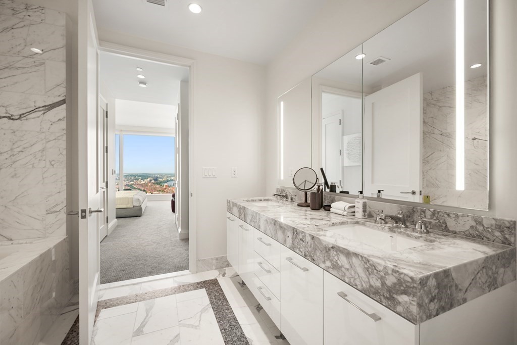 240 Devonshire Street, Unit 5503 Boston, MA 02110 - Photo 13 of 42 a en suite bathroom with a sink and a mirror