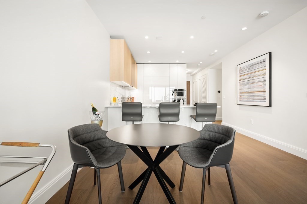 240 Devonshire Street, Unit 5503 Boston, MA 02110 - Photo 8 of 42 a view of a dining room with furniture and wooden floor
