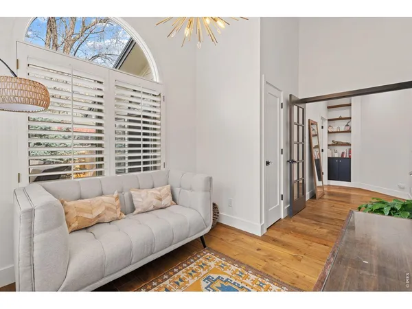 a living room with furniture and a open kitchen