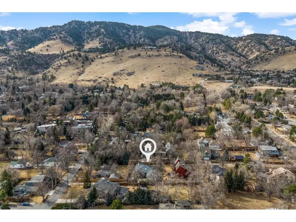 a view of aerial view of a house with a mountain