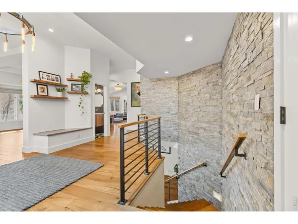 a living room with stainless steel appliances kitchen island granite countertop furniture and a kitchen view