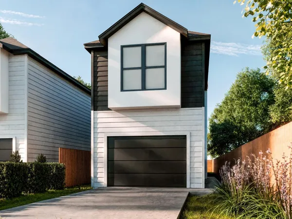a front view of a house with a garage