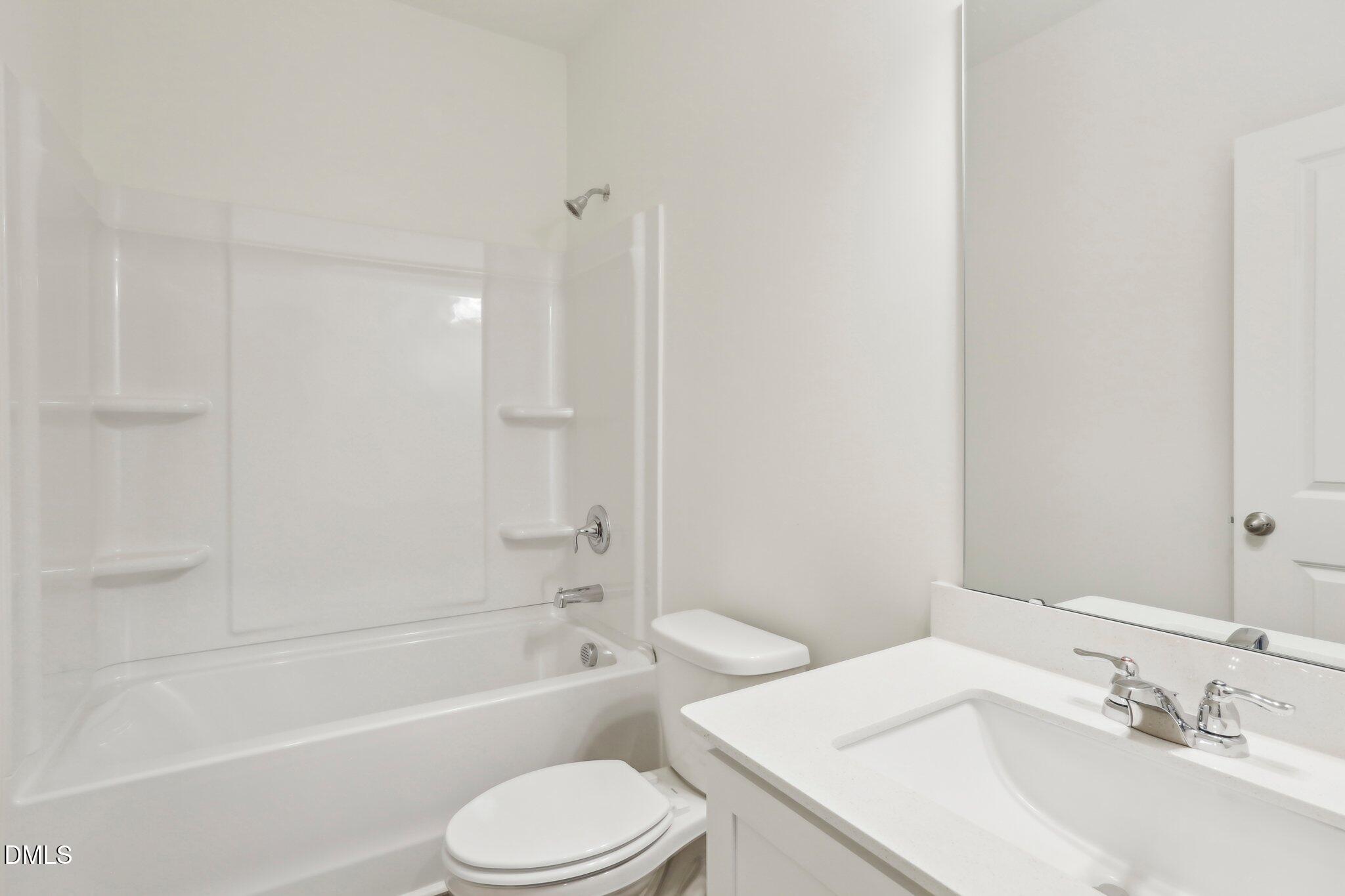 2573 Quarry Road Rolesville, NC 27571 - Photo 24 of 44 a bathroom with a sink toilet and bathtub