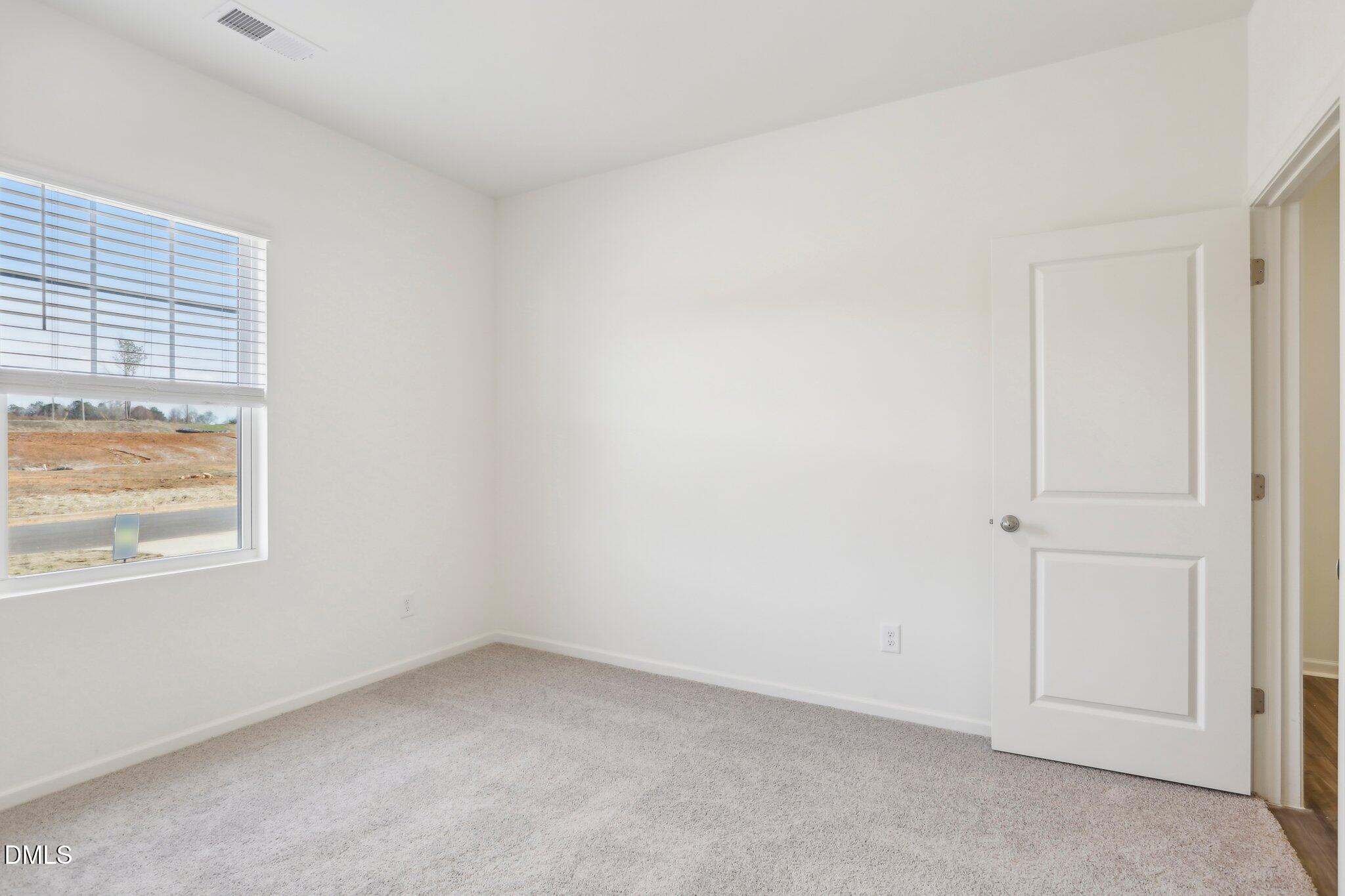 2573 Quarry Road Rolesville, NC 27571 - Photo 26 of 44 an empty room with a window