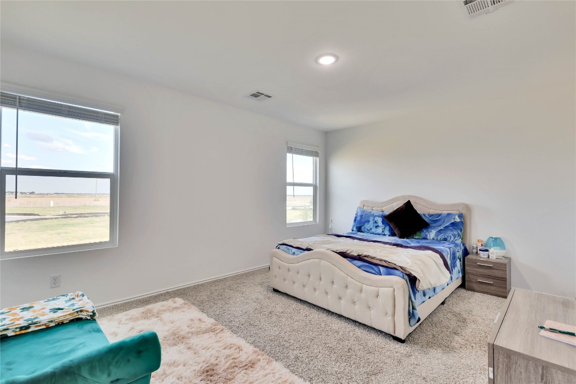 124 Canley Loop Hutto, TX 78634 - Photo 11 of 19 Very spacious primary bedroom.
