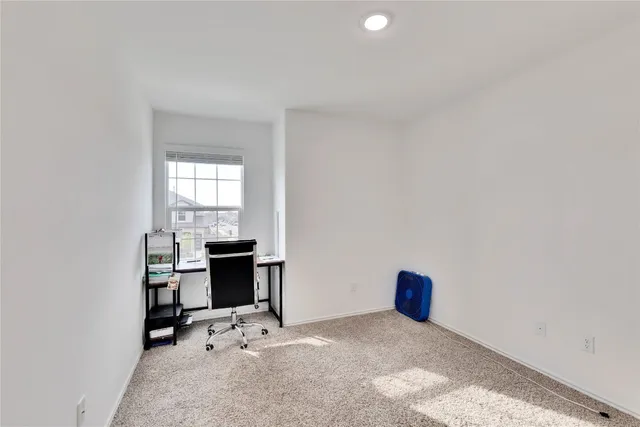 a view of empty room with windows