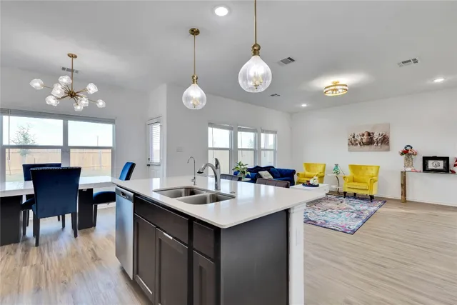 a kitchen with a counter space cabinets and appliances
