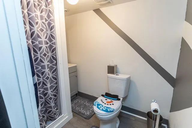 a view of water heater room with furniture and toys