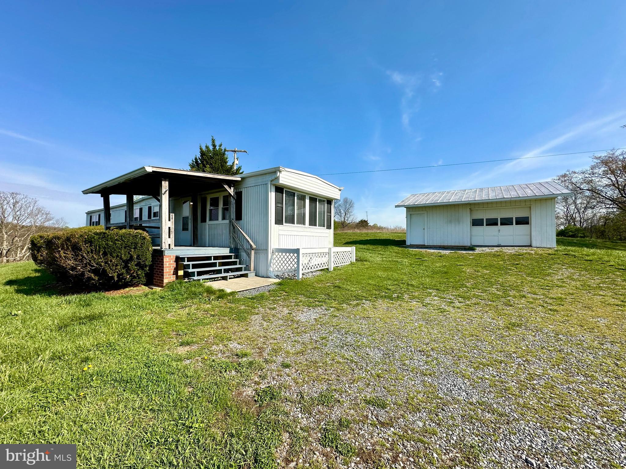 11449 A Alton Road Frederick, MD 21701 - Photo 2 of 25 a front view of a house with a yard