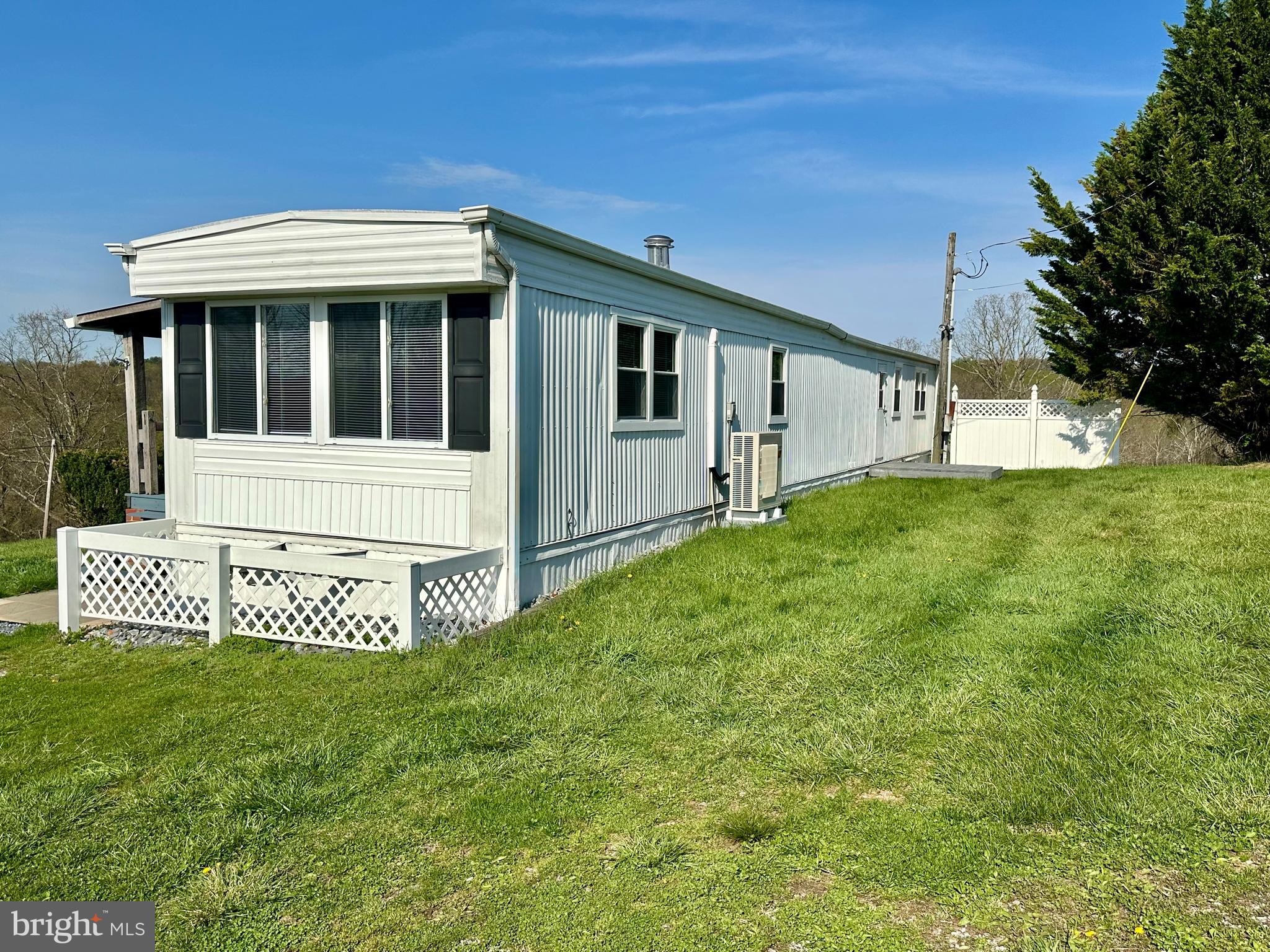 11449 A Alton Road Frederick, MD 21701 - Photo 23 of 25 a front view of a house with a garden