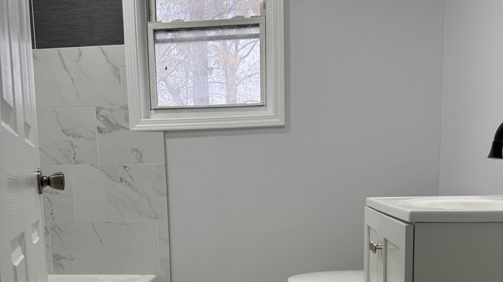 102 8th Avenue Mendota, IL 61342 - Photo 8 of 12 a bathroom with a window a sink and a toilet