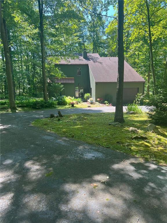 103 Woodcock Road Farmington, PA 15437 - Photo 2 of 3 a view of a house with a yard