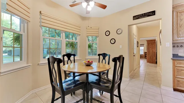 a living room with furniture and a clock
