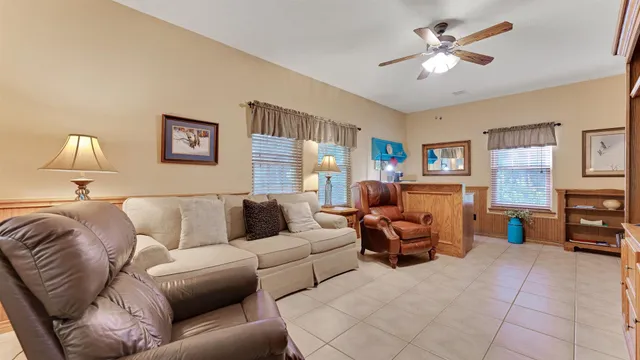 a spacious bathroom with a granite countertop sink a bathtub and a mirror