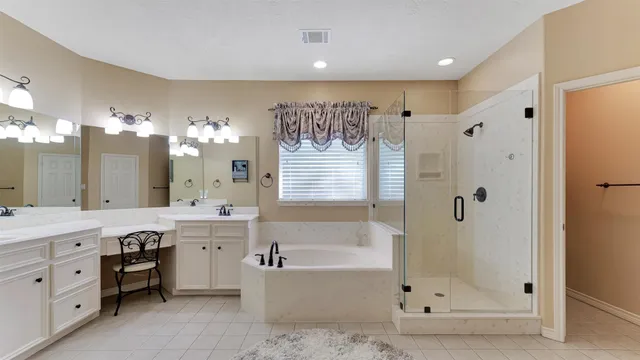 a bathroom with a sink a light fixture and a mirror