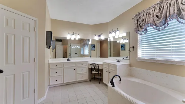 a bedroom with a bed and a table in it