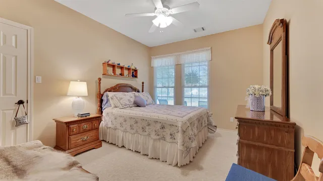a room with furniture a chandelier and a window