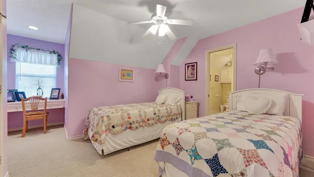 a bedroom with furniture and a window