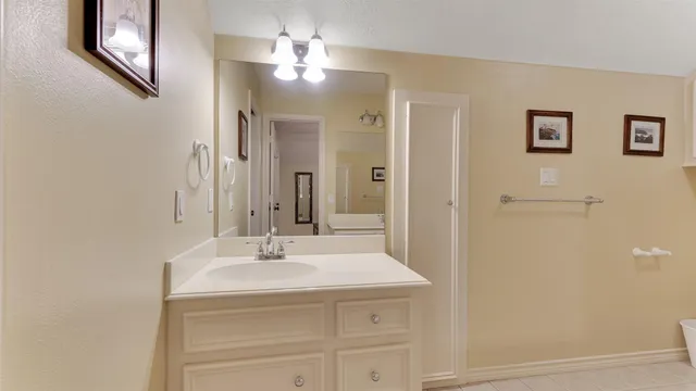 a view of a patio with table and chairs and a barbeque