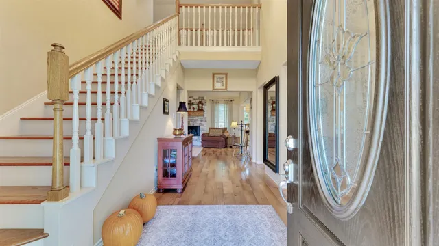 a view of a dining room with furniture and a window