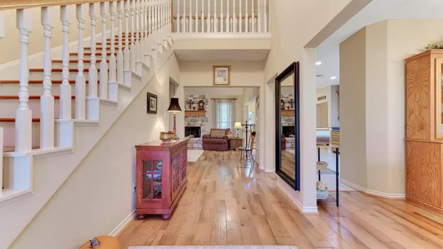 a kitchen with stainless steel appliances kitchen island granite countertop a sink and refrigerator