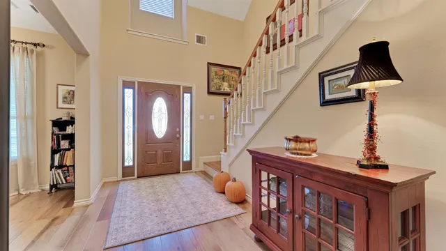a kitchen with granite countertop stainless steel appliances a sink and cabinets