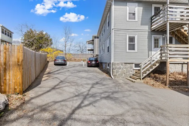 a view of a house with a snow in the yard