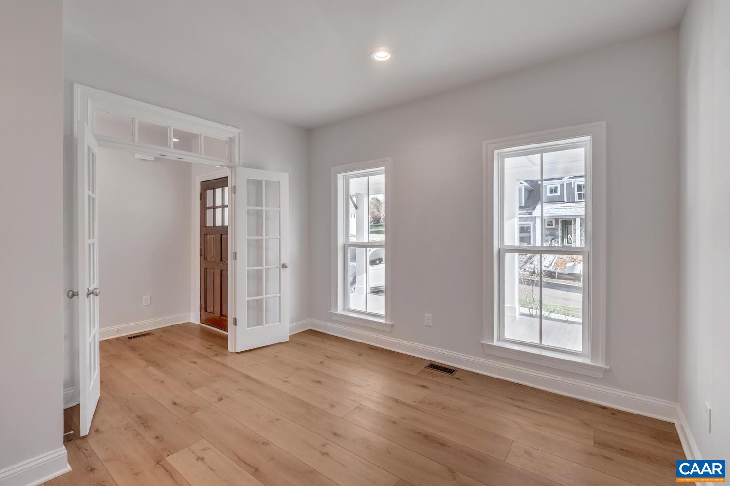 1150 Riparian Court Charlottesville, VA 22911 - Photo 11 of 67 an empty room with wooden floor and windows