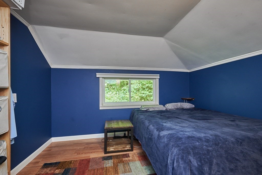 19 Spruce Corner Road Goshen, MA 01032 - Photo 17 of 41 a bed sitting in a room next to a window