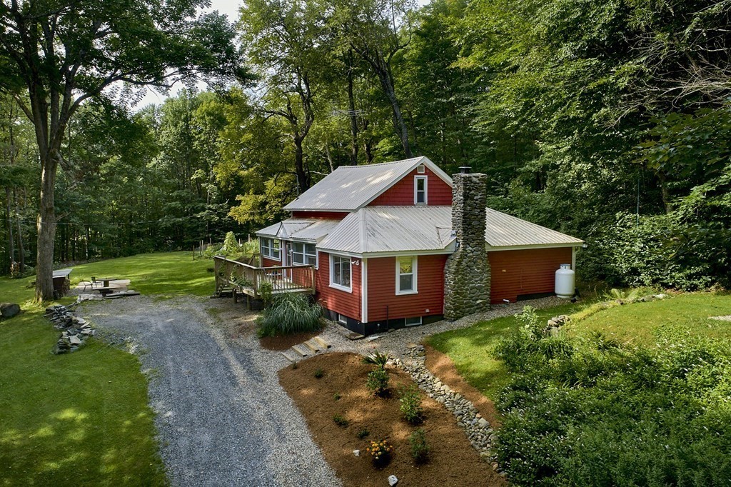 19 Spruce Corner Road Goshen, MA 01032 - Photo 2 of 41 a front view of a house with garden