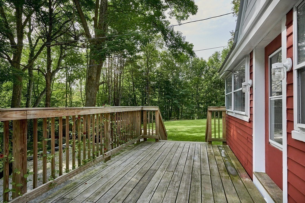 19 Spruce Corner Road Goshen, MA 01032 - Photo 29 of 41 a balcony with wooden floor and trees in the back