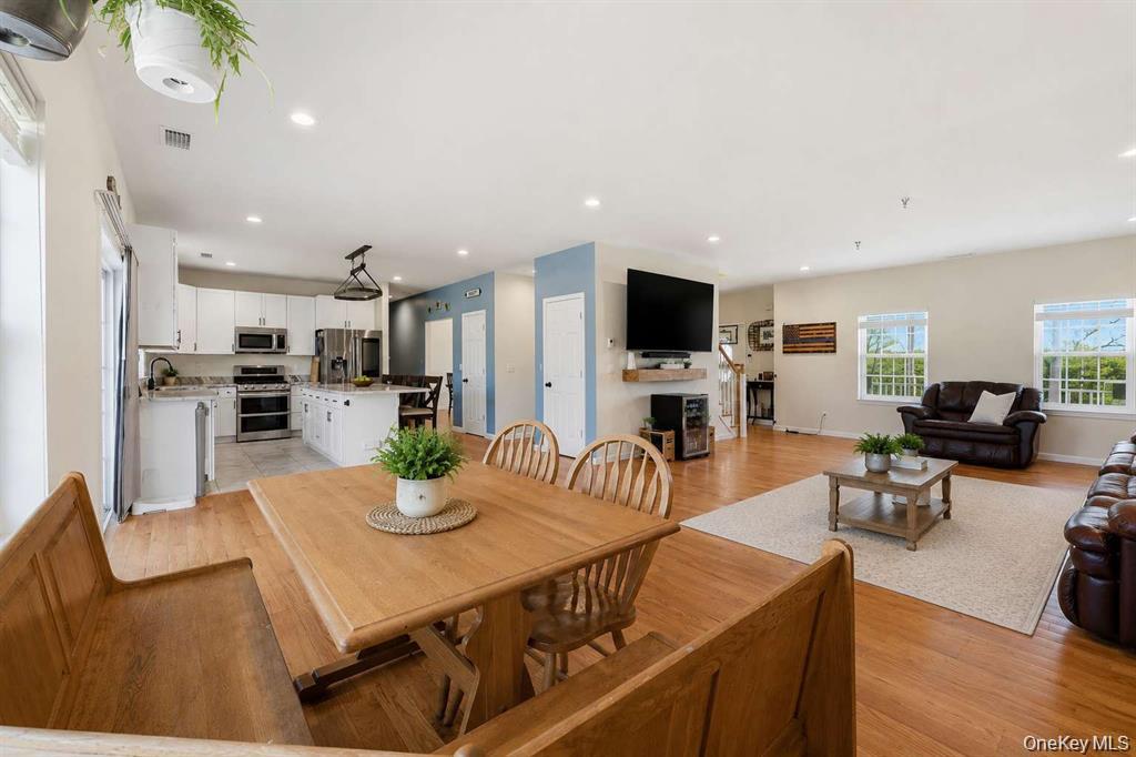 133 Old Chester Road Goshen, NY 10924 - Photo 10 of 33 a kitchen with stainless steel appliances granite countertop a table chairs microwave and sink
