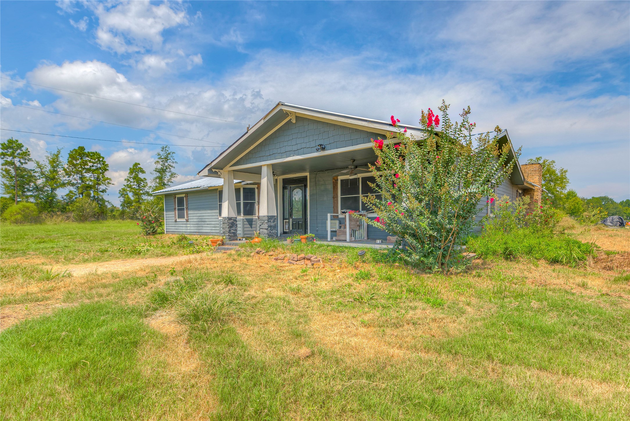 6982 Highway 94 Trinity, TX 75862 - Photo 24 of 33 a front view of a house with a yard