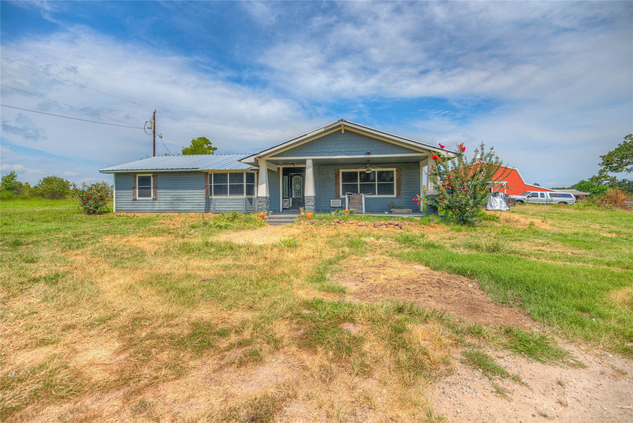 6982 Highway 94 Trinity, TX 75862 - Photo 25 of 33 a front view of house with yard and trees