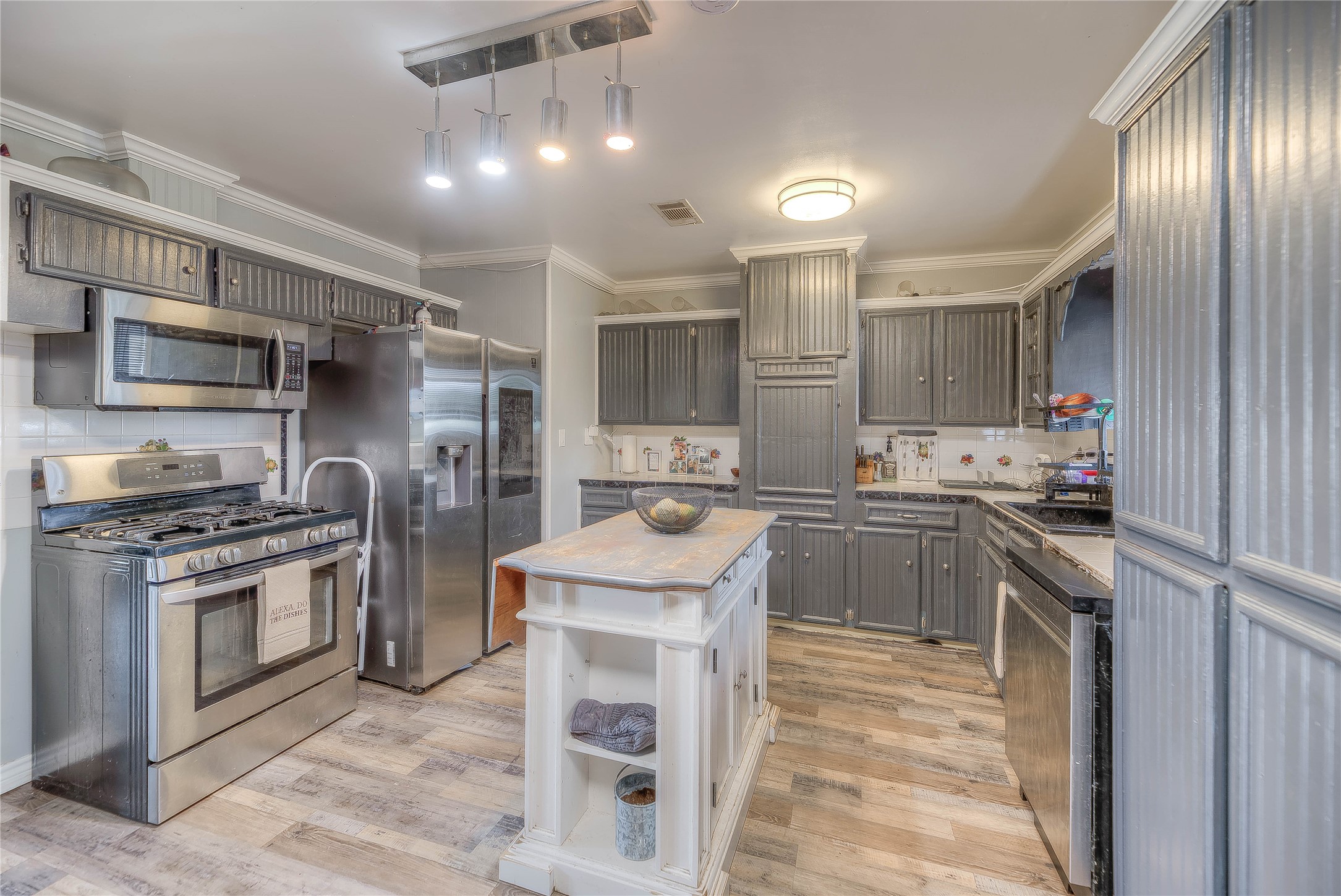 6982 Highway 94 Trinity, TX 75862 - Photo 8 of 33 a kitchen with stainless steel appliances granite countertop a sink stove and refrigerator