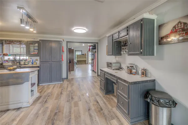 a kitchen with a sink cabinets and stainless steel appliances