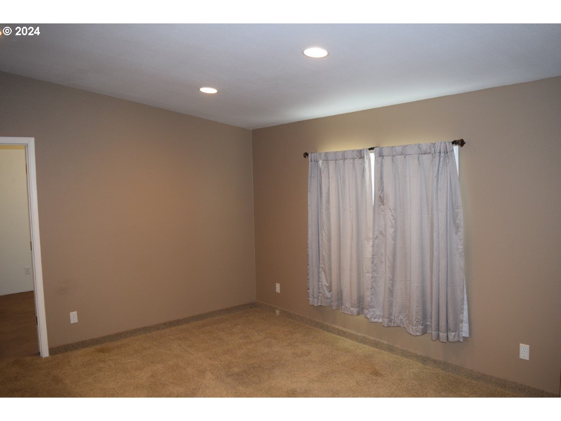 325 West Sherman Road Athena, OR 97813 - Photo 7 of 27 a view of an empty room with a window
