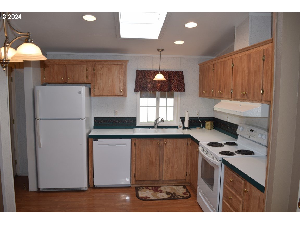 325 West Sherman Road Athena, OR 97813 - Photo 8 of 27 a kitchen with stainless steel appliances granite countertop a refrigerator a sink dishwasher and a stove