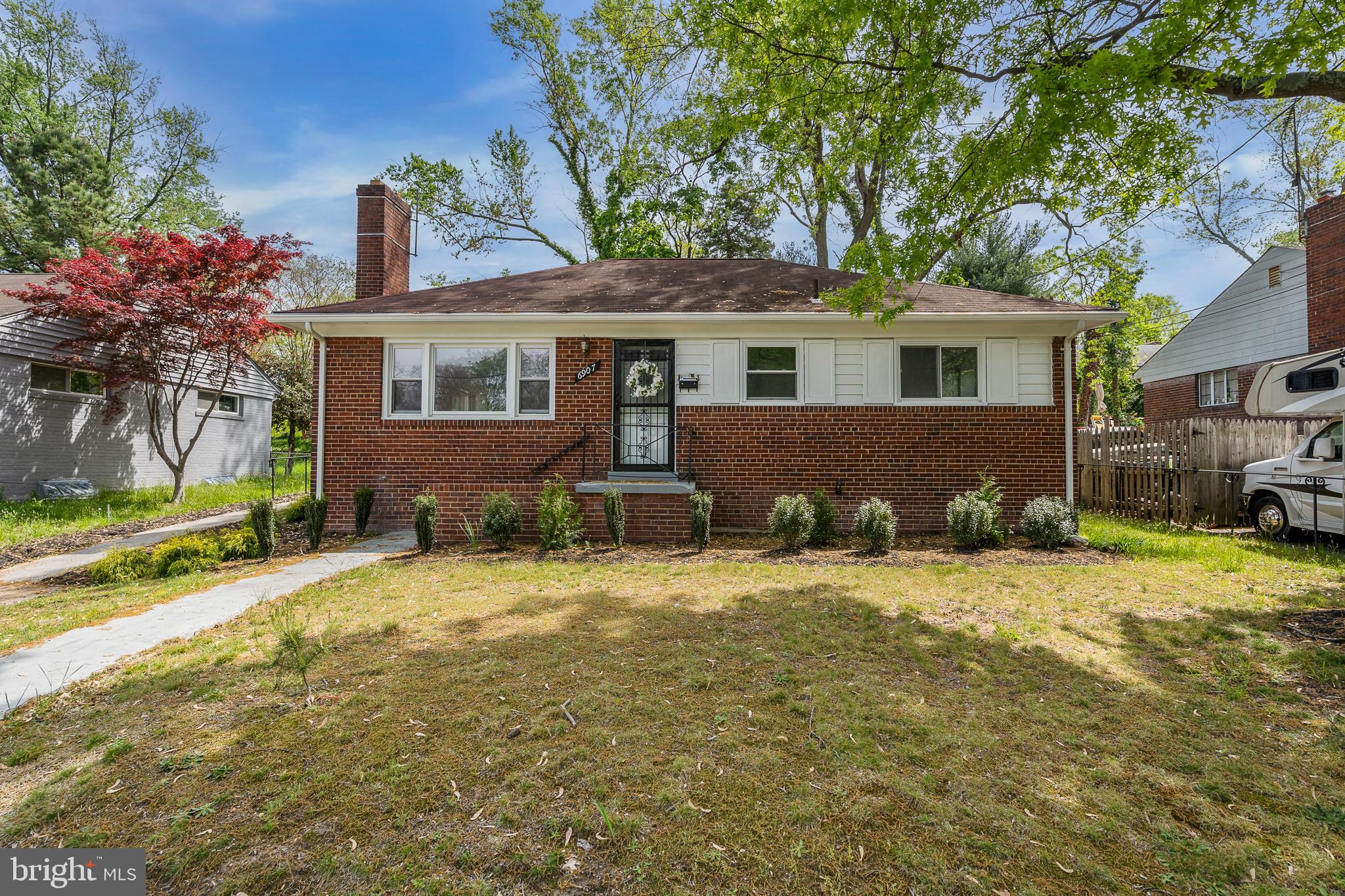 6907 Kipling Parkway District Heights, MD 20747 - Photo 1 of 39 a front view of a house with a garden