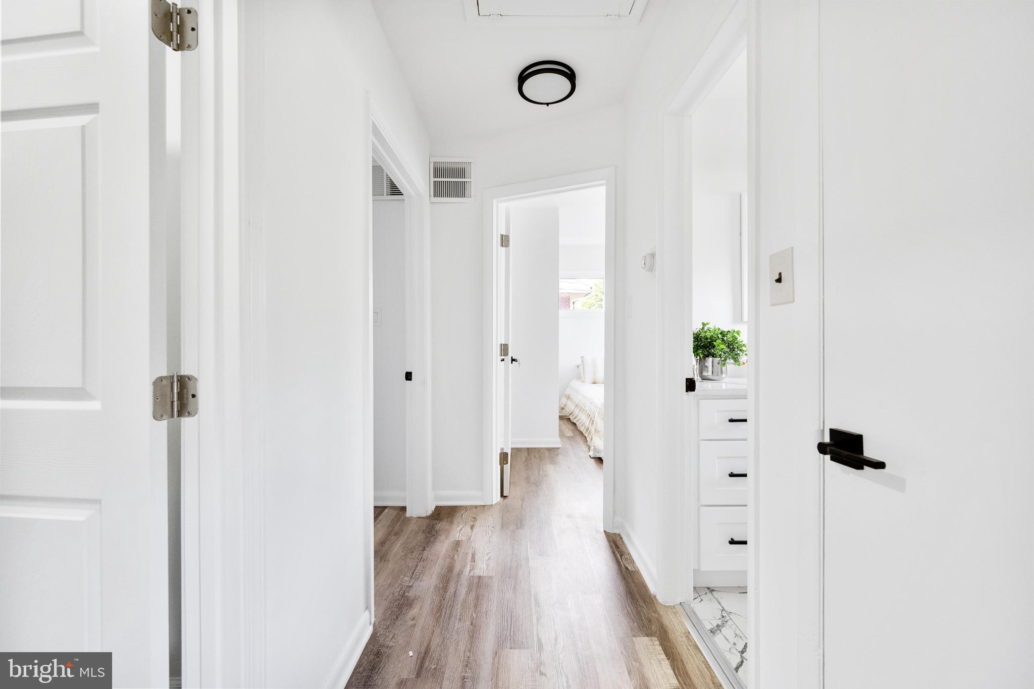 6907 Kipling Parkway District Heights, MD 20747 - Photo 15 of 39 a view of a hallway with wooden floor