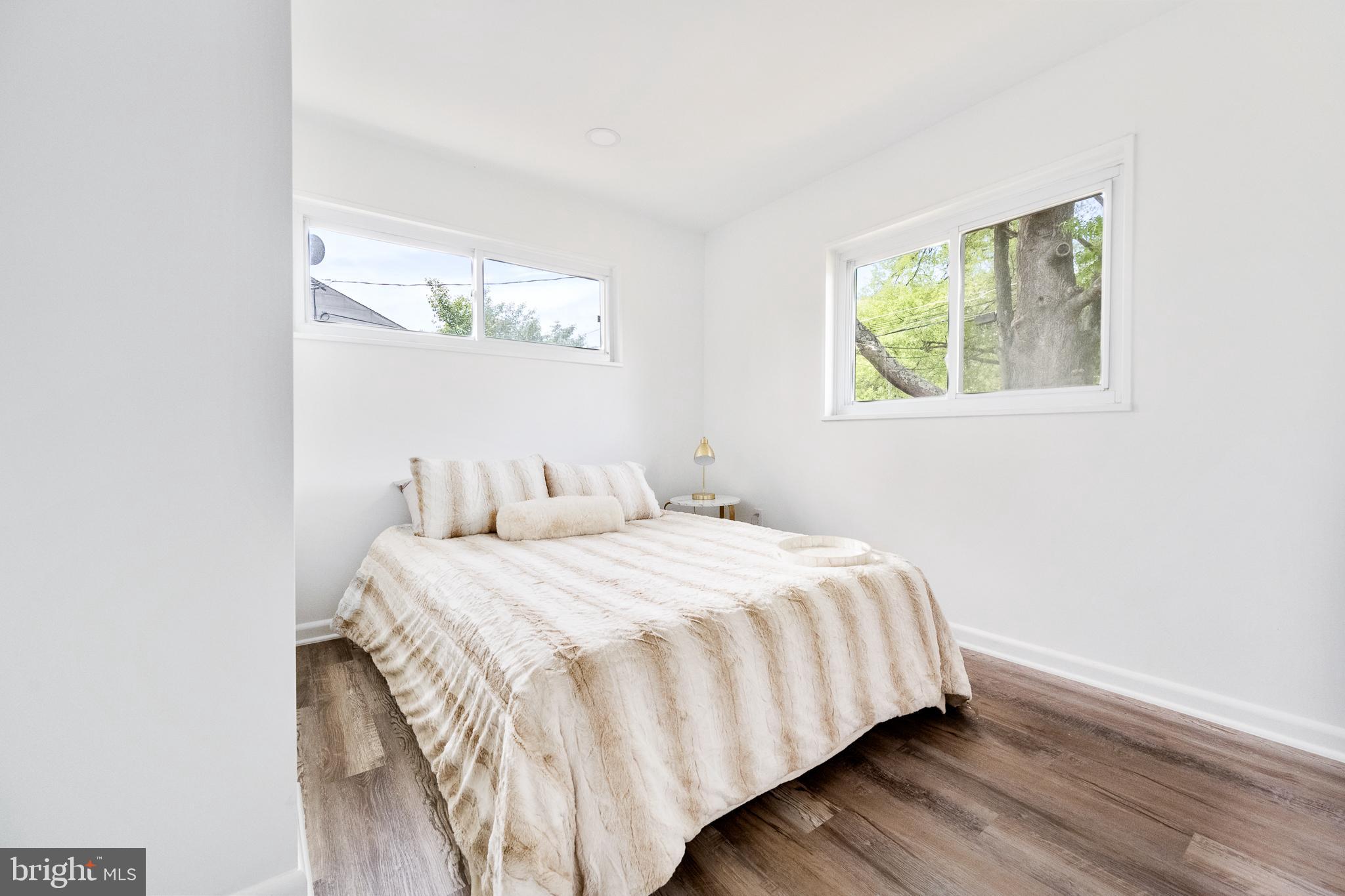 6907 Kipling Parkway District Heights, MD 20747 - Photo 16 of 39 a bedroom with a bed and window