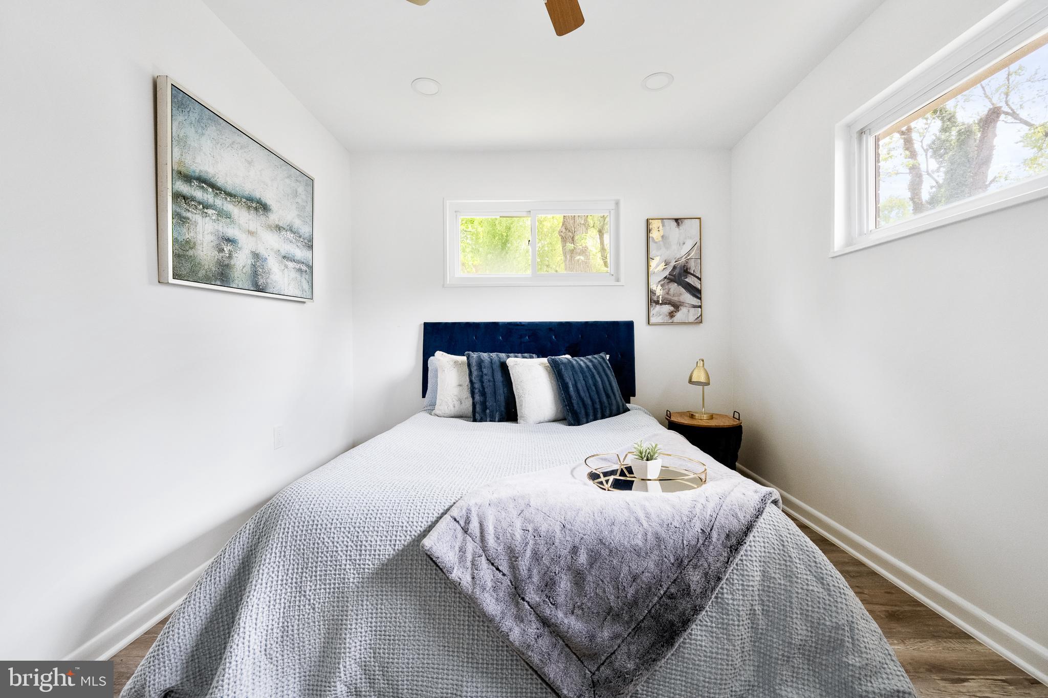 6907 Kipling Parkway District Heights, MD 20747 - Photo 20 of 39 a bedroom with a bed and window